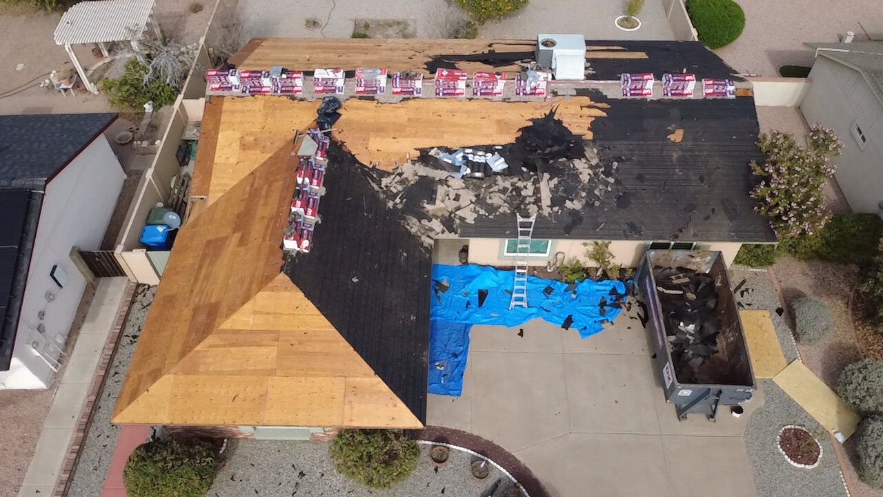 CS1 1 Before photo of an aging shingle roof in Phoenix with missing shingles and visible wear