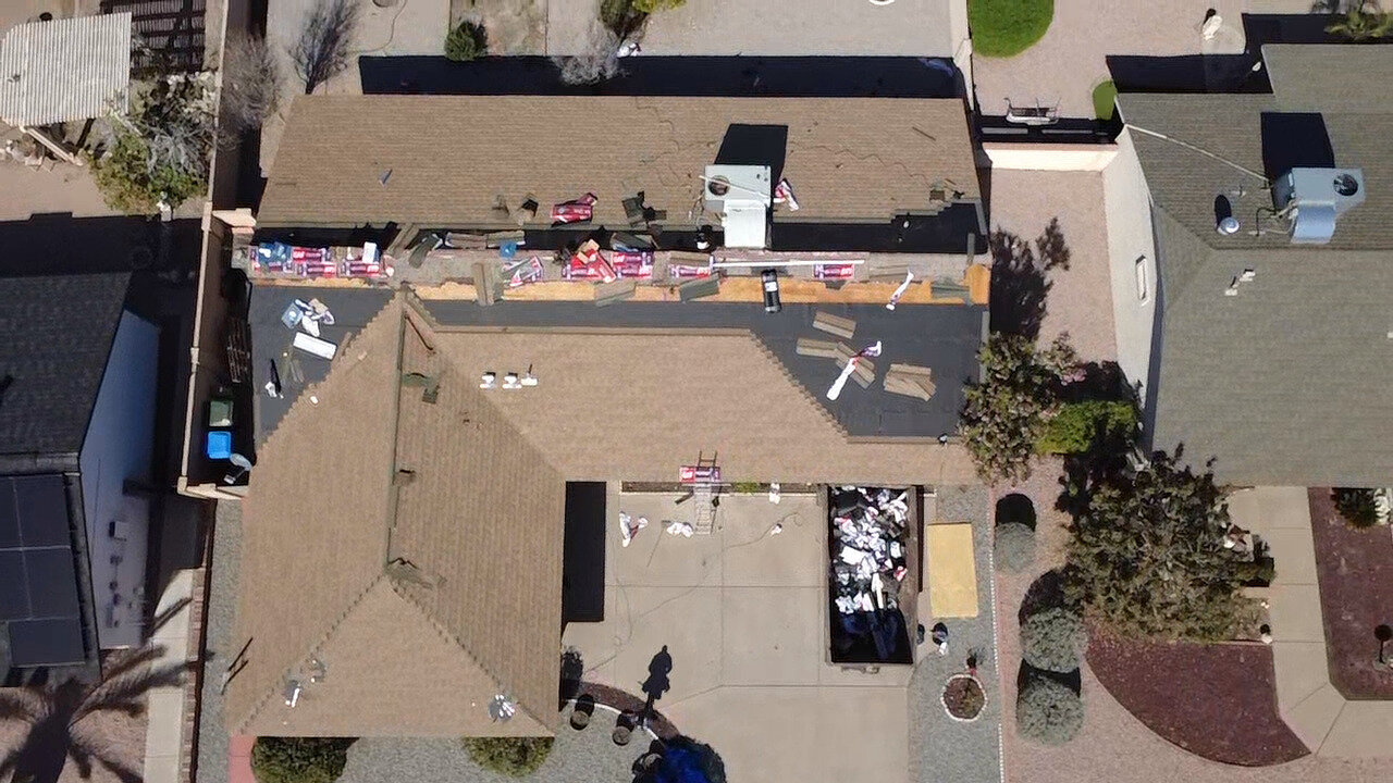 CS1 5 Before photo of a residential shingle roof in Phoenix prior to replacement, showing aging and missing materials