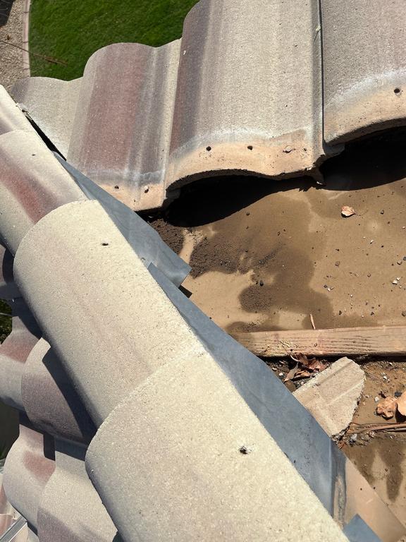 CS2 1 Before photo showing a tile roof area in Gilbert with visible distress near a leak location